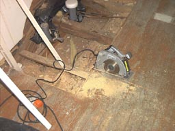 sawing the wood floor